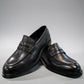 Romitan Tondar black leather slip-on dress shoes with a classic penny loafer design. Photo of front view.