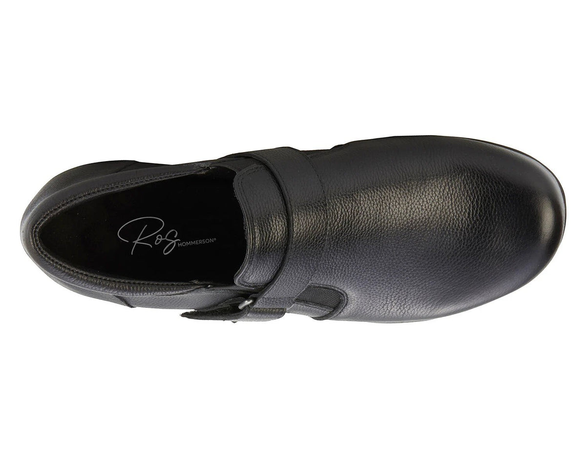 Ros Hommerson Eliot black tumbled leather loafer with adjustable hook and loop strap and low block heel.
photo of the top side