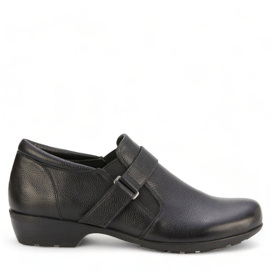 Ros Hommerson Eliot black tumbled leather loafer with adjustable hook and loop strap and low block heel.
photo of the right side