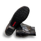 Ros Hommerson Esme black leather ankle bootie with ruched vamp detailing and a low stacked heel.
photo of the bottom side