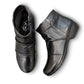 Ros Hommerson Esme black leather ankle bootie with ruched vamp detailing and a low stacked heel.
photo of the top side