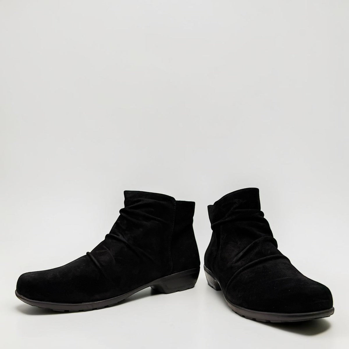 Ros Hommerson Esme black suede ankle bootie with ruched vamp .
photo of the front side