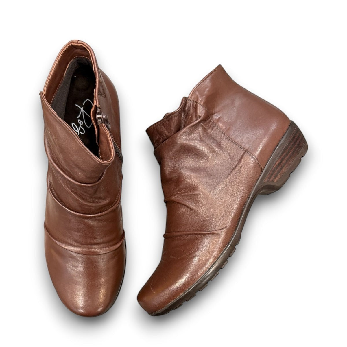 Ros Hommerson Esme brown leather ankle bootie with ruched vamp detailing and a low stacked heel.
photo of the top side