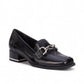 Ros Hommerson Evie black shiny tumbled leather loafer with square toe, chain detail, and block heel.
photo of the front side