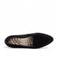 Ros Hommerson Honey black suede loafer with patent leather piping and a low crescent heel.
photo of the top side