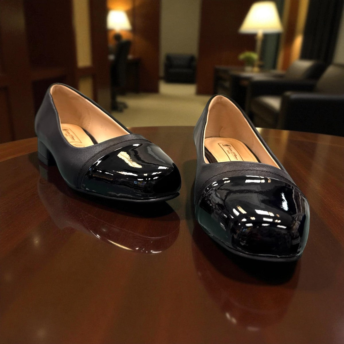 Sabatini of Florence SF1 black slip-on shoe with a glossy cap-toe and low block heel.
photo of the front side