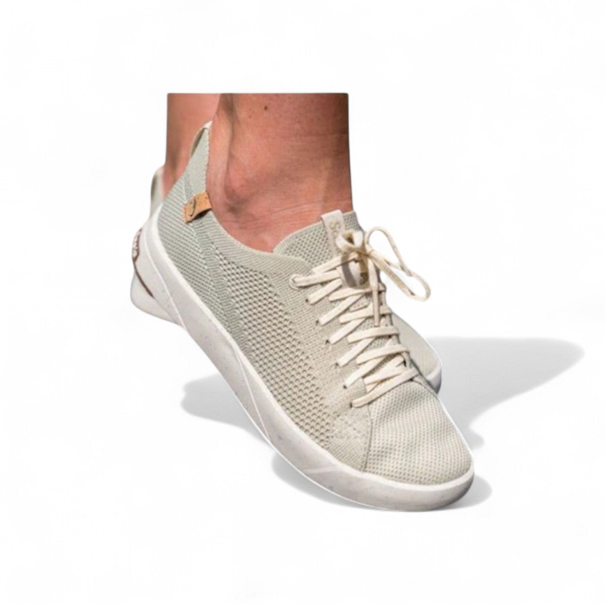 SAOLA Cannon Knit 2.0W sneakers in faded green with a sustainable recycled knit upper and cork details. Photo of side view.