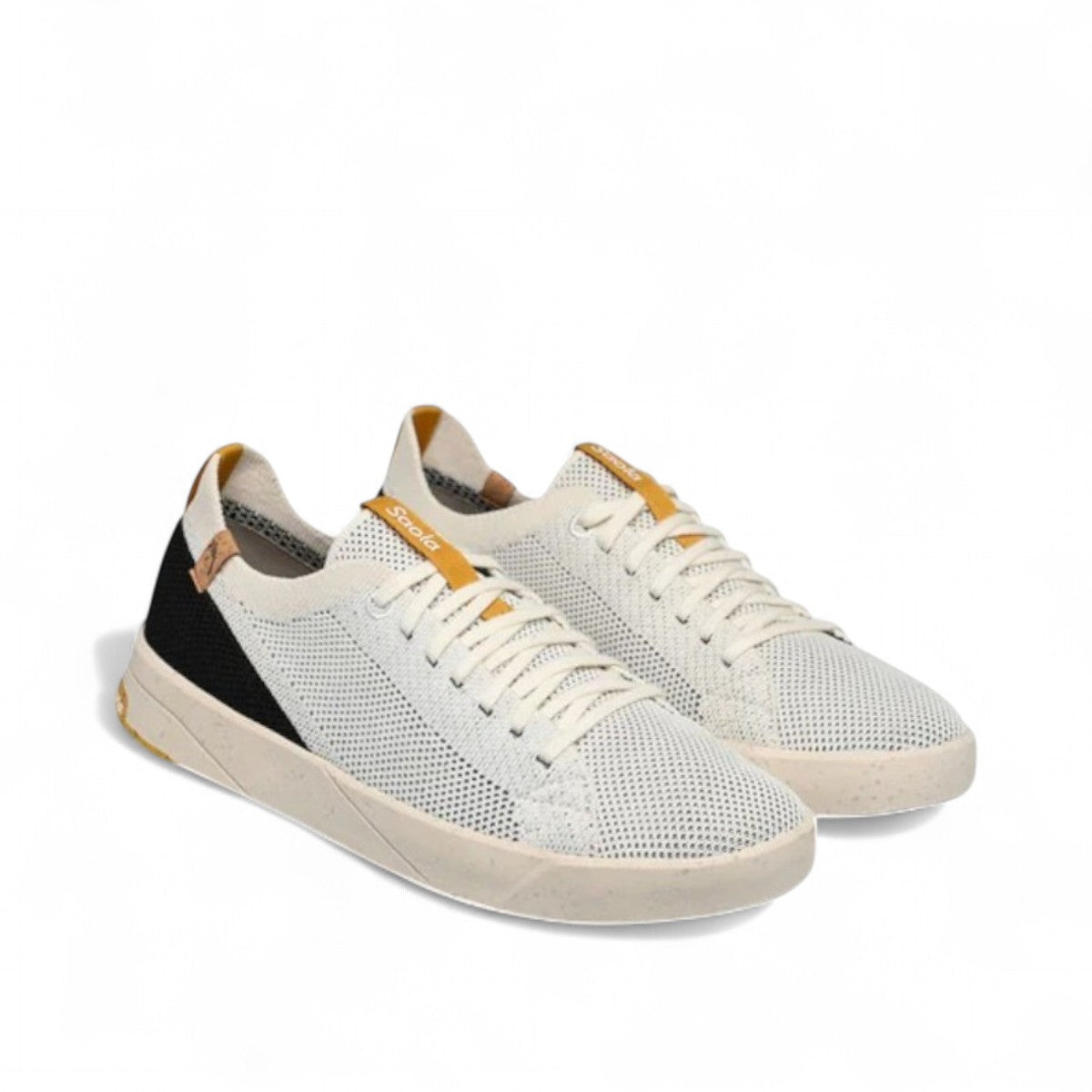 SAOLA Cannon Knit 2.0 sneaker in white and black with a sustainable recycled knit upper and cork details. Photo of front side views.