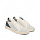 SAOLA Cannon Knit 2.0 sneakers in white and navy with a sustainable recycled knit upper and cork detail. Photo of side views.