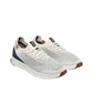 SAOLA Tsavo 2.0M sneaker in white and navy with a breathable knit upper and cork detail. Photo of front side views.