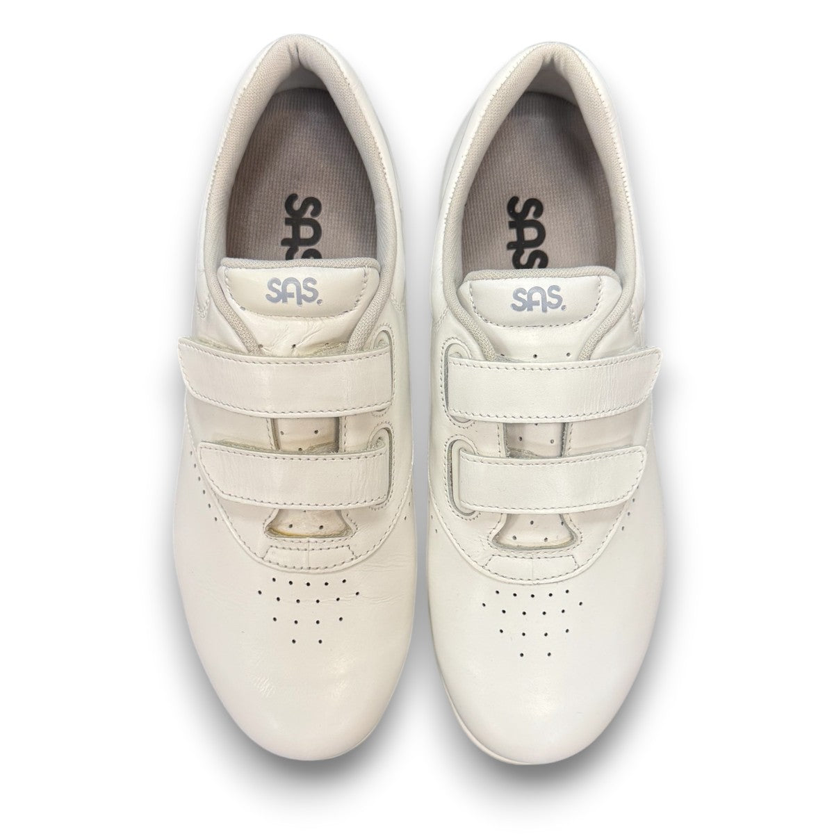 SAS Me Too white leather athletic walking shoe with adjustable EZ straps and cushioned sole.
photo of the top side