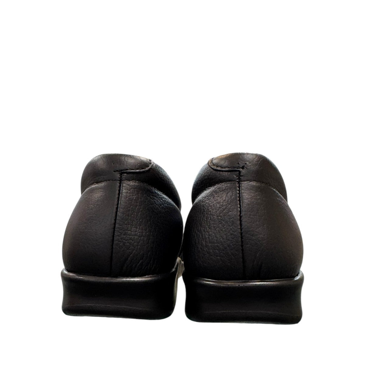 SAS Twin black leather slip-on moccasin shoe with elastic side panels and cushioned polyurethane outsole.
photo of the back side