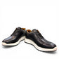 SHAHIN KOOROSH black leather lace-up sneaker with a white rubber sole and refined handmade stitching. Photo of front side view 2.