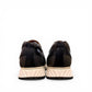 SHAHIN KOOROSH black leather lace-up sneaker with a white rubber sole and refined handmade stitching. Photo of back view.