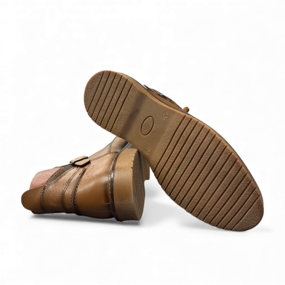 Sina Footwear Anzali 2 tan leather lace-up boots with side buckle detail, rubber outsole, and refined stitching. Photo of bottom view.