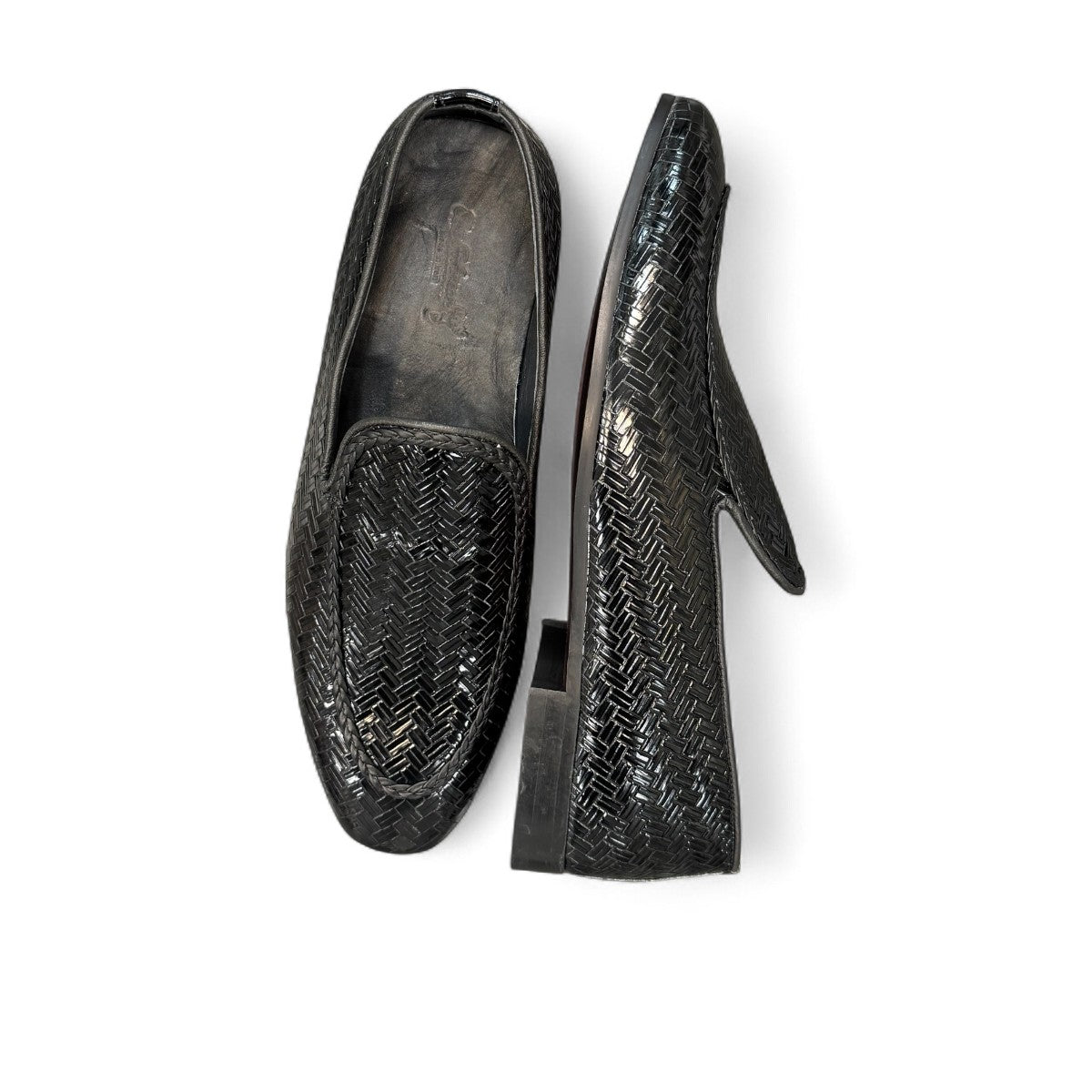 Sina Footwear Aspad black patent leather loafers with a woven texture and refined handmade stitching. Photo of the sole.