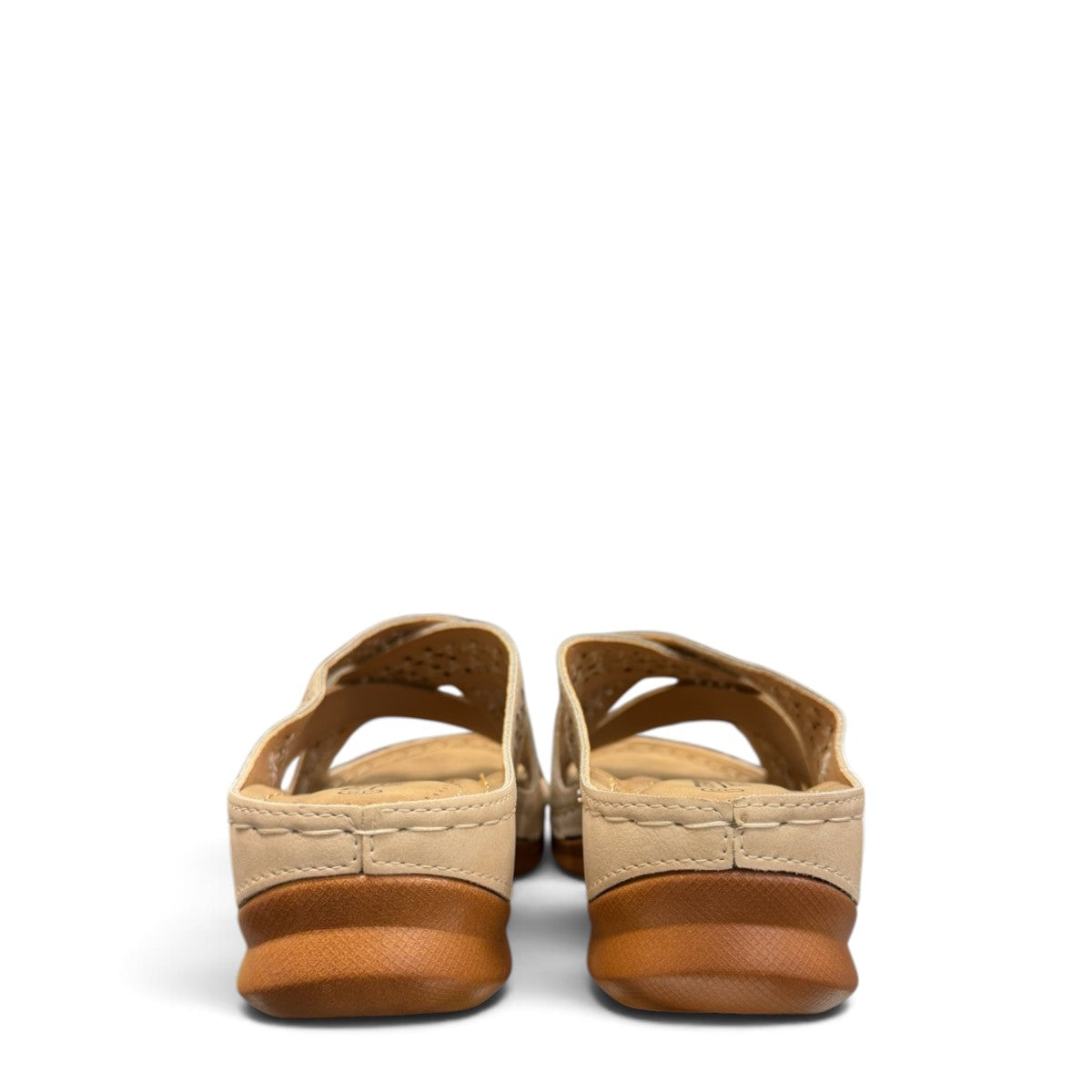 Sina Footwear beige vegan leather slide sandals with floral cut-out straps and a cushioned comfort sole.
photo of the back side