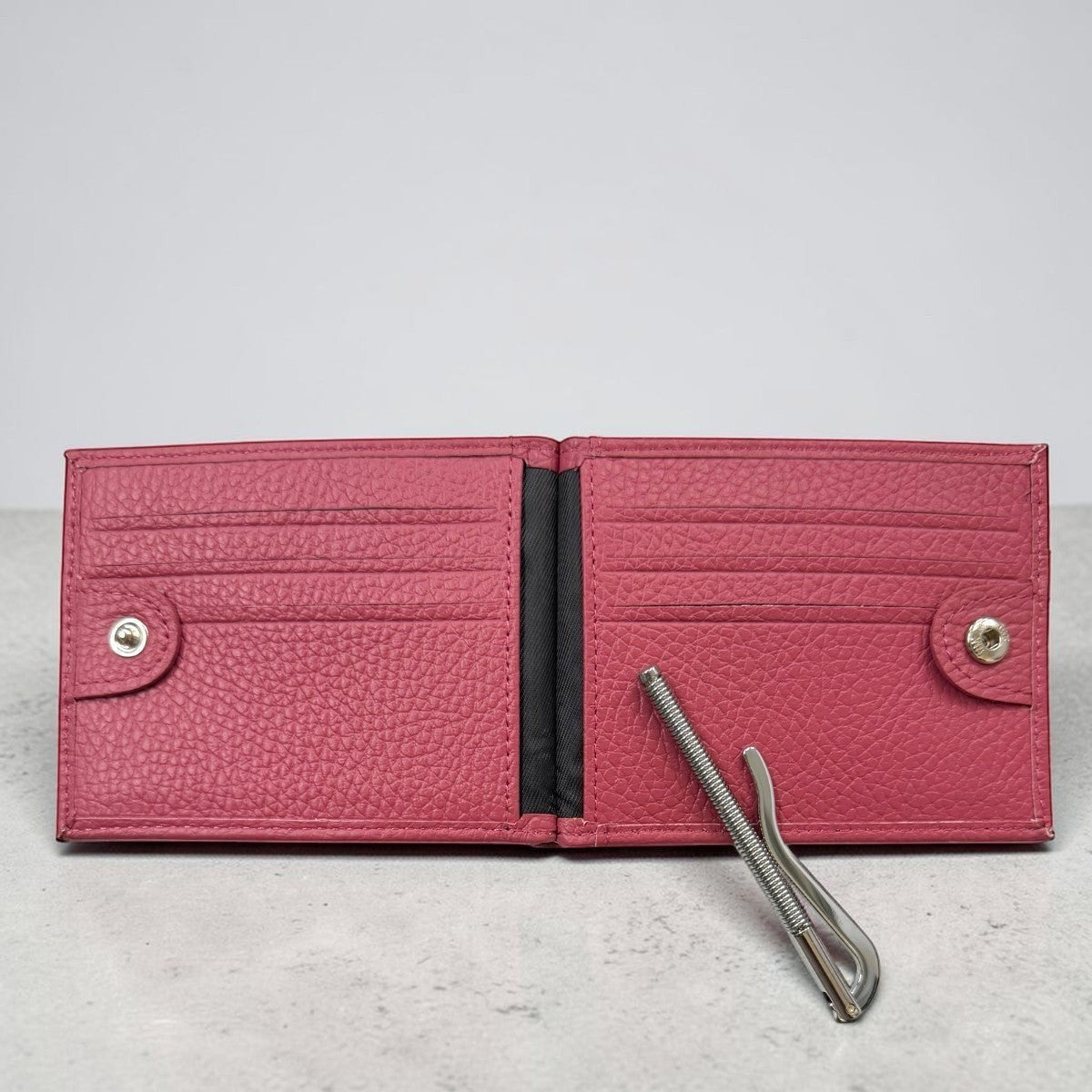 Sina Footwear berry textured leather bifold wallet with money clip and card slots.