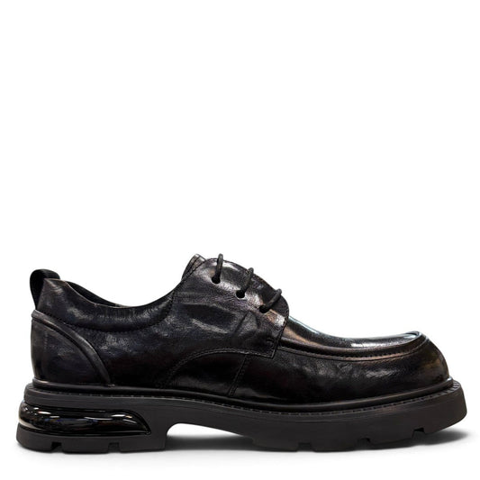 Sina Footwear black leather derby shoe with a chunky lug sole and lace-up closure in a modern silhouette.
photo of the right side