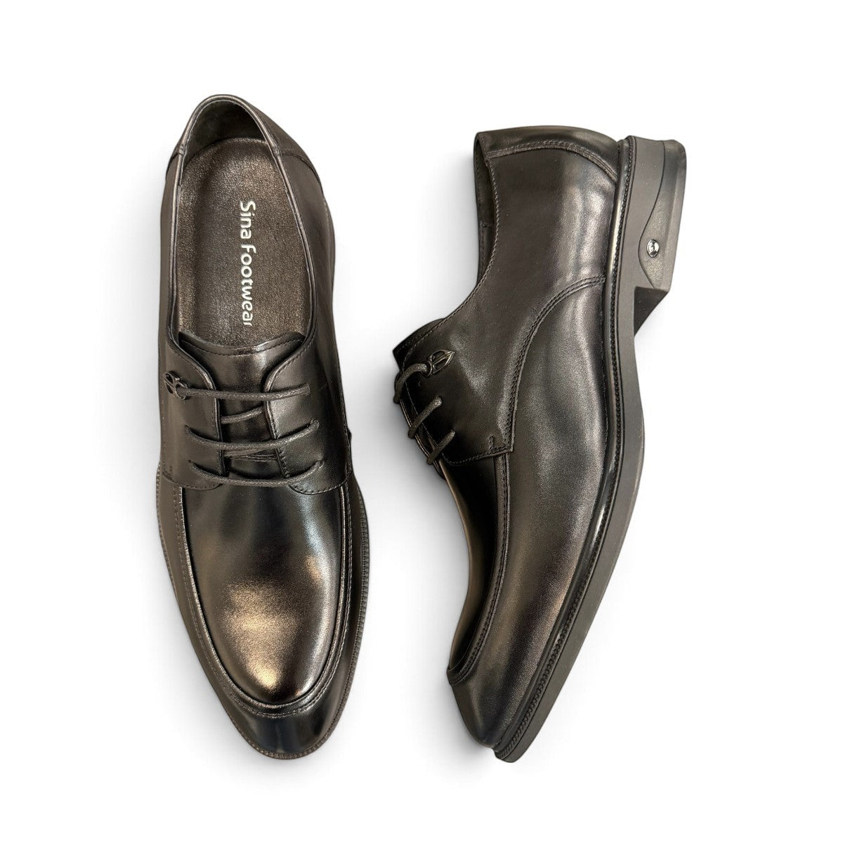 Sina Footwear black leather derby shoes with apron-toe construction, lace-up closure, and durable rubber outsole.
photo of the top side