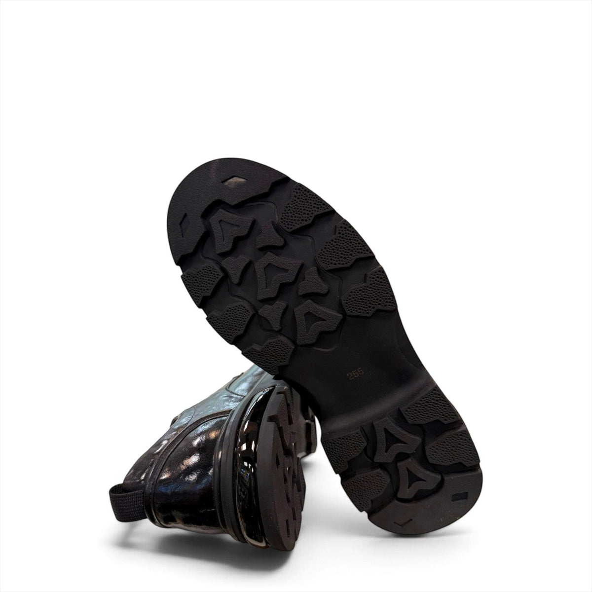 Sina Footwear black leather derby shoe with a chunky lug sole and lace-up closure in a modern silhouette.
photo of the bottom side