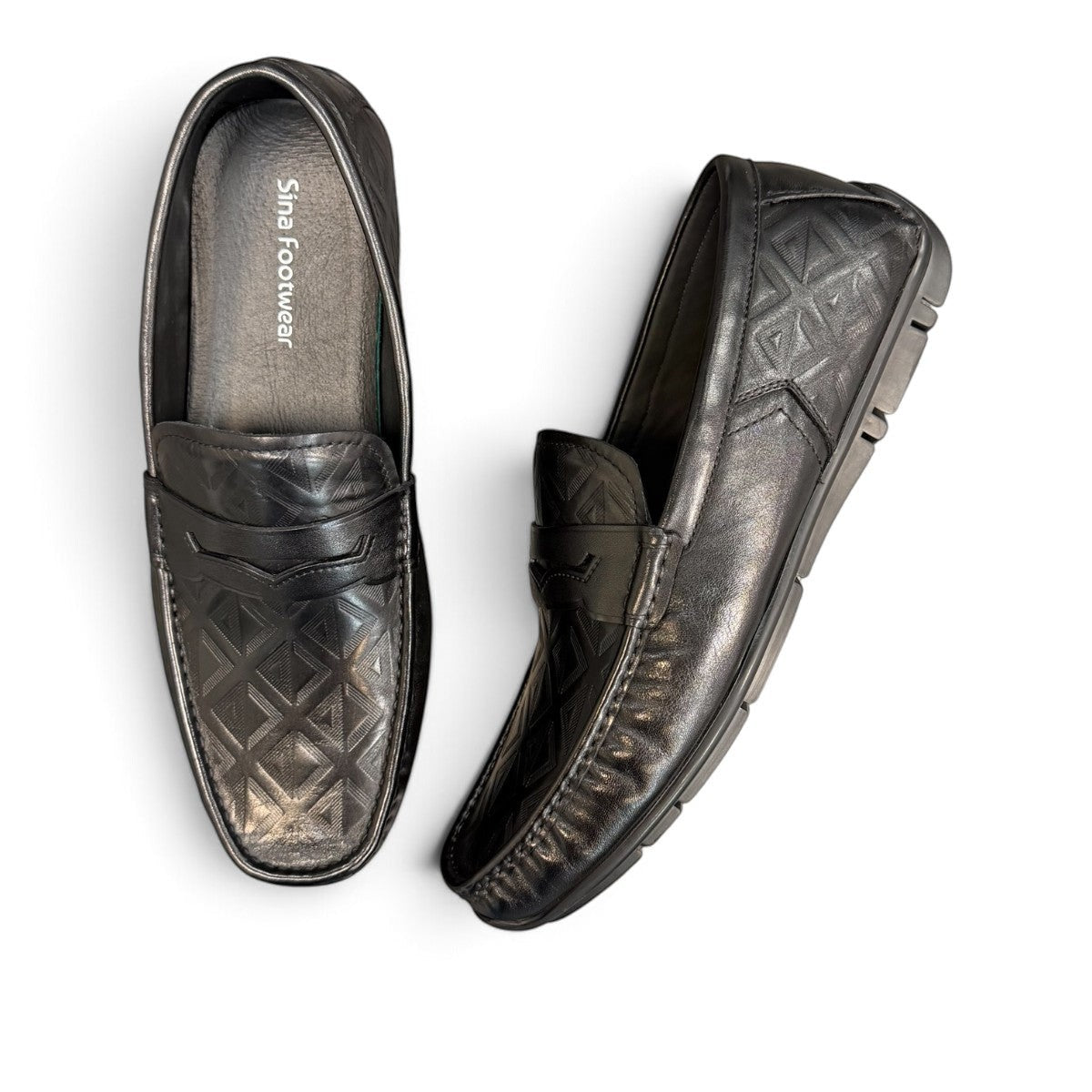 Sina Footwear black genuine leather loafer with embossed geometric pattern and slip-on design.
 photo of the top side