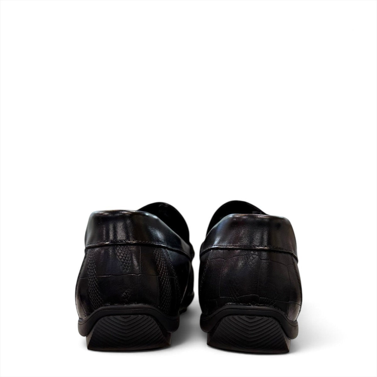 Sina Footwear black genuine leather loafer with a textured vamp strap and durable rubber outsole.
photo of the back side