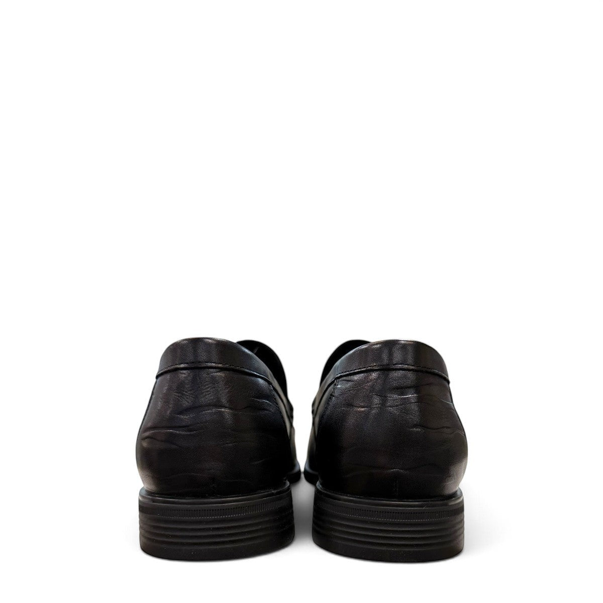 Sina Footwear black genuine leather loafer with a classic silhouette, stitched detailing, and durable rubber outsole.
photo of the back side