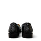 Sina Footwear black genuine leather slip-on loafer with hand-finished gathered detailing and a durable rubber outsole.
photo of the back side