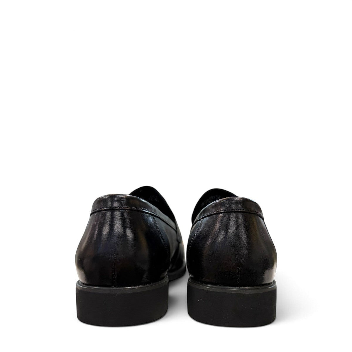 Sina Footwear black genuine leather loafer with a classic silhouette, slip-on design, and durable rubber outsole.
photo of the back side