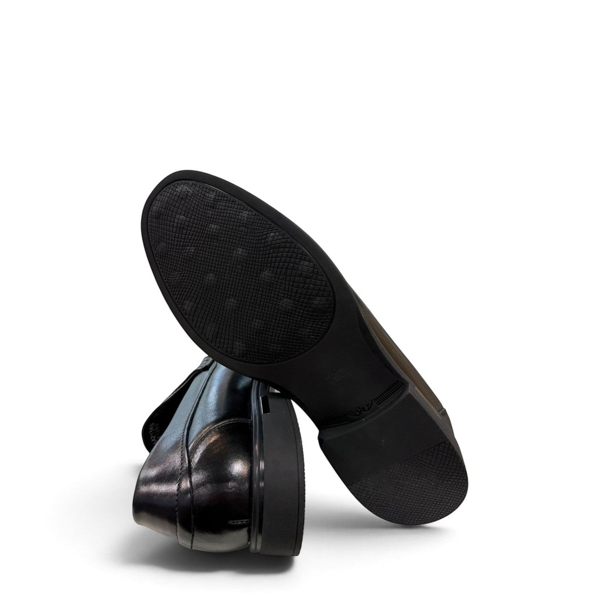 Sina Footwear black genuine leather loafer with a classic slip-on silhouette, cushioned footbed, and rubber outsole.
photo of the bottom side
