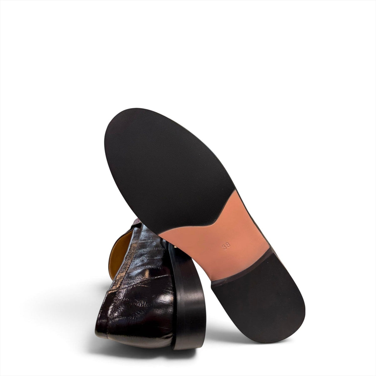 Sina Footwear black genuine leather slip-on loafer with hand-finished gathered detailing and a durable rubber outsole.
photo of the bottom side