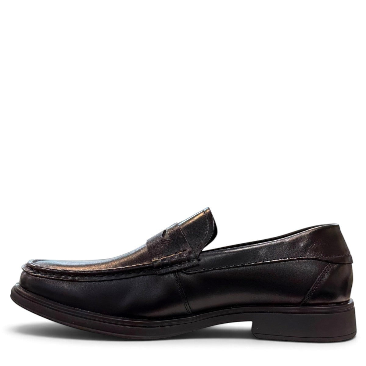 Sina Footwear black genuine leather loafer with a classic slip-on silhouette, cushioned footbed, and rubber outsole.
photo of the left side