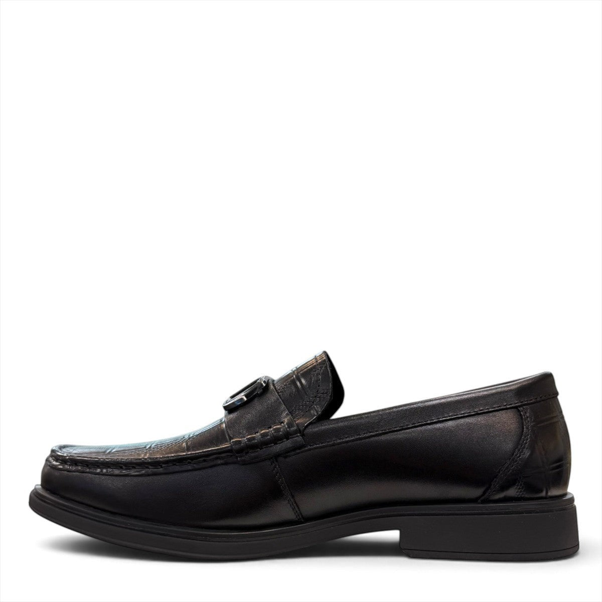 Sina Footwear black genuine leather loafers with a crocodile-embossed texture and a sleek slip-on design.
photo of the left side