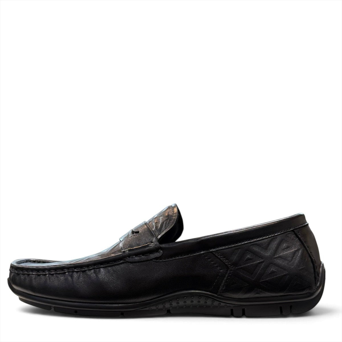Sina Footwear black genuine leather loafer with embossed geometric pattern and slip-on design.
 photo of the left side