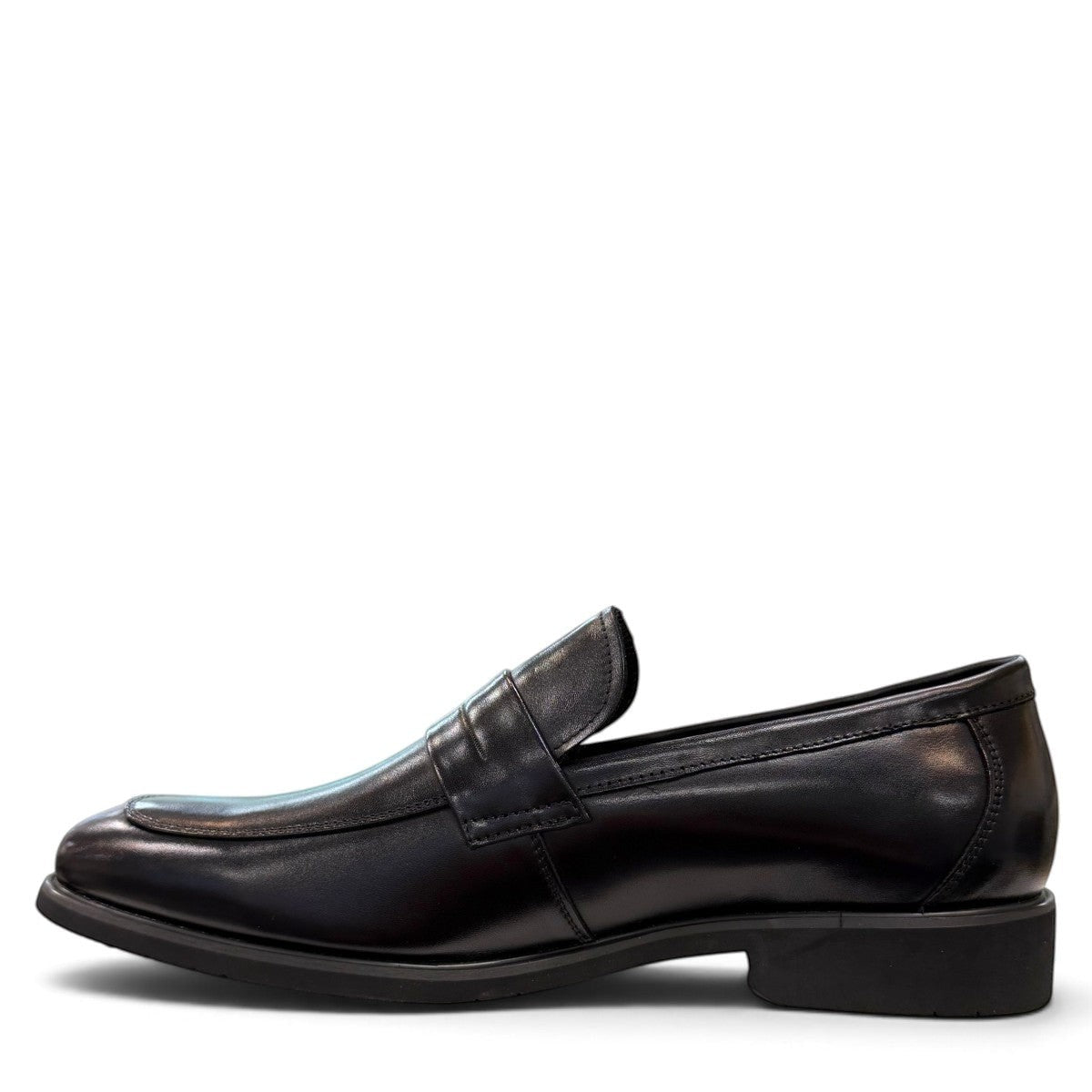 Sina Footwear black genuine leather loafer with a classic silhouette, slip-on design, and durable rubber outsole.
photo of the left side