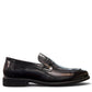 Sina Footwear black genuine leather loafer with a classic silhouette, slip-on design, and durable rubber outsole.
photo of the right side