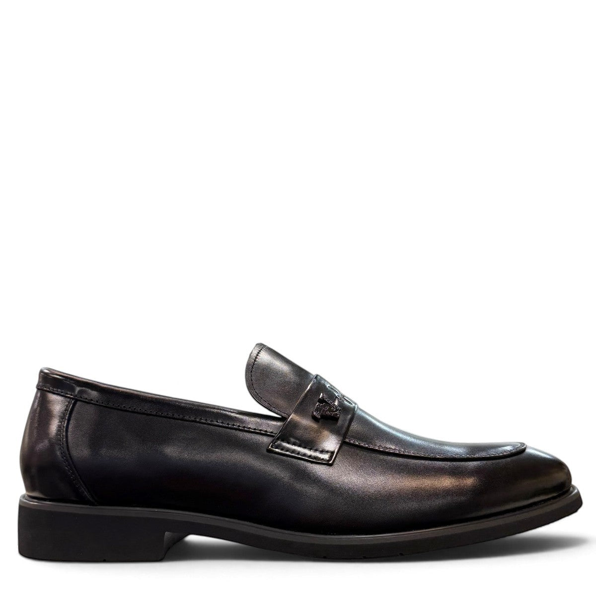 Sina Footwear black genuine leather loafer with a classic silhouette, slip-on design, and durable rubber outsole.
photo of the right side