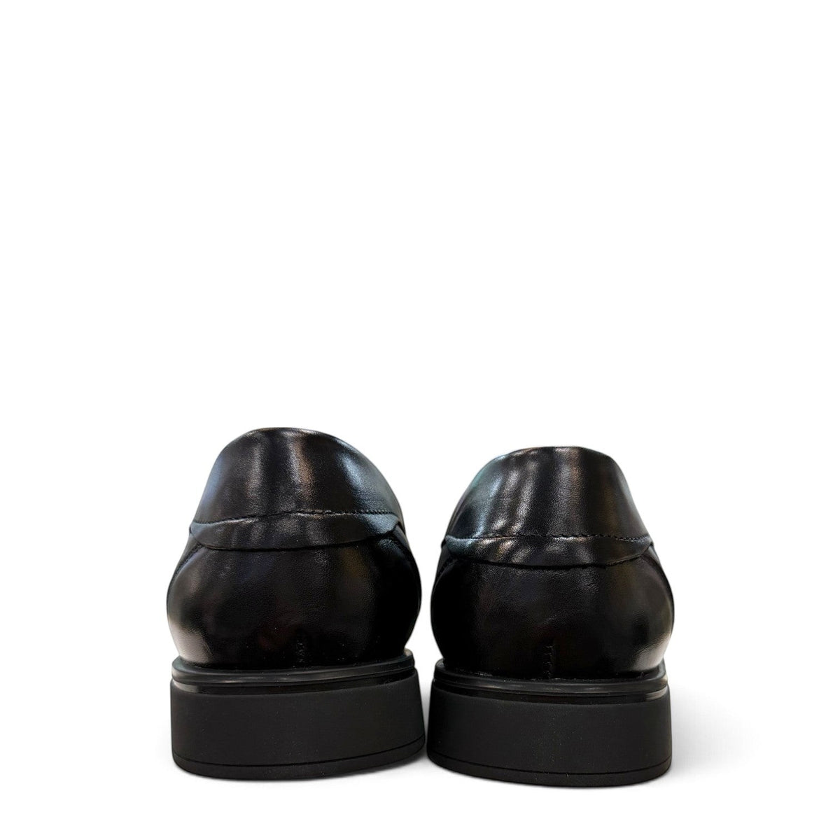 Sina Footwear black genuine leather loafer with a classic slip-on silhouette, cushioned footbed, and rubber outsole.
photo of the back side