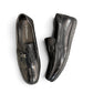 Sina Footwear black genuine leather loafer with a textured vamp strap and durable rubber outsole.
photo of the top side