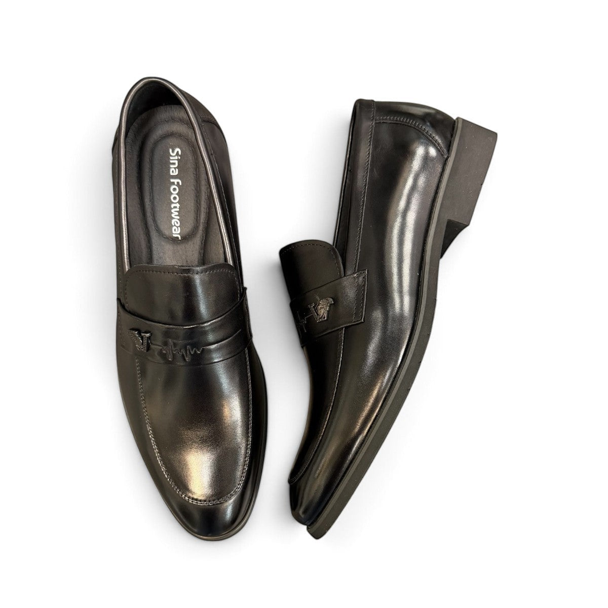 Sina Footwear black genuine leather loafer with a classic silhouette, slip-on design, and durable rubber outsole.
photo of the top side