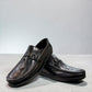 Sina Footwear black genuine leather loafer with a textured vamp strap and durable rubber outsole.
photo of the front side
