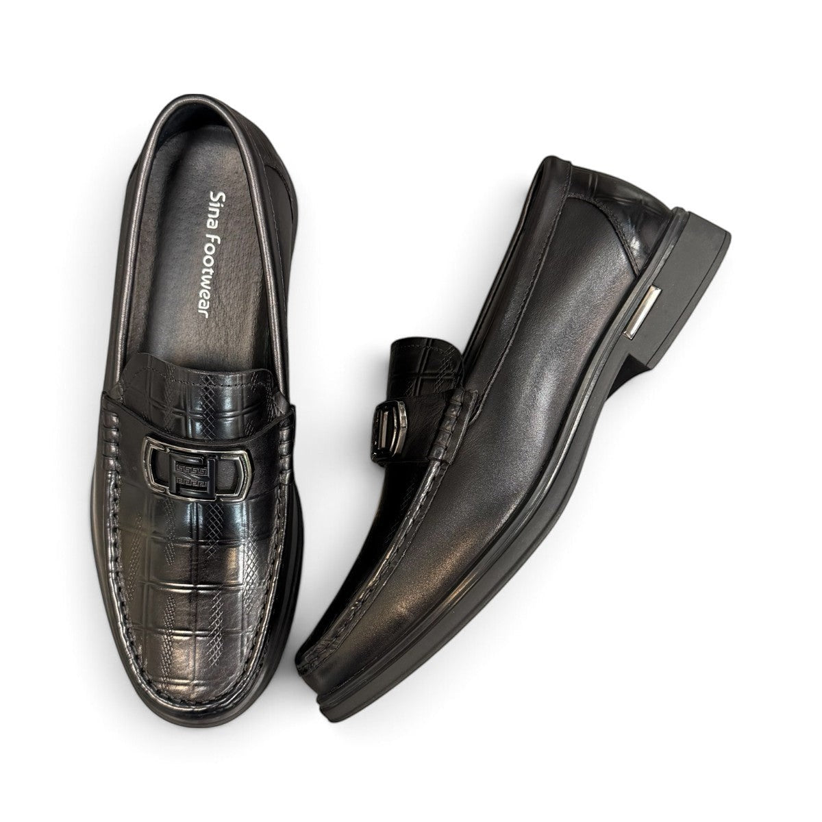 Sina Footwear black genuine leather loafers with a crocodile-embossed texture and a sleek slip-on design.
photo of the top side