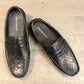 Sina Footwear black genuine leather loafer with embossed geometric pattern and slip-on design.
 photo of the top side