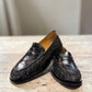 Sina Footwear black genuine leather slip-on loafer with hand-finished gathered detailing and a durable rubber outsole.
photo of the front side