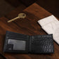 Sina Footwear genuine leather bi-fold wallet in black with multiple card slots and ID window.
