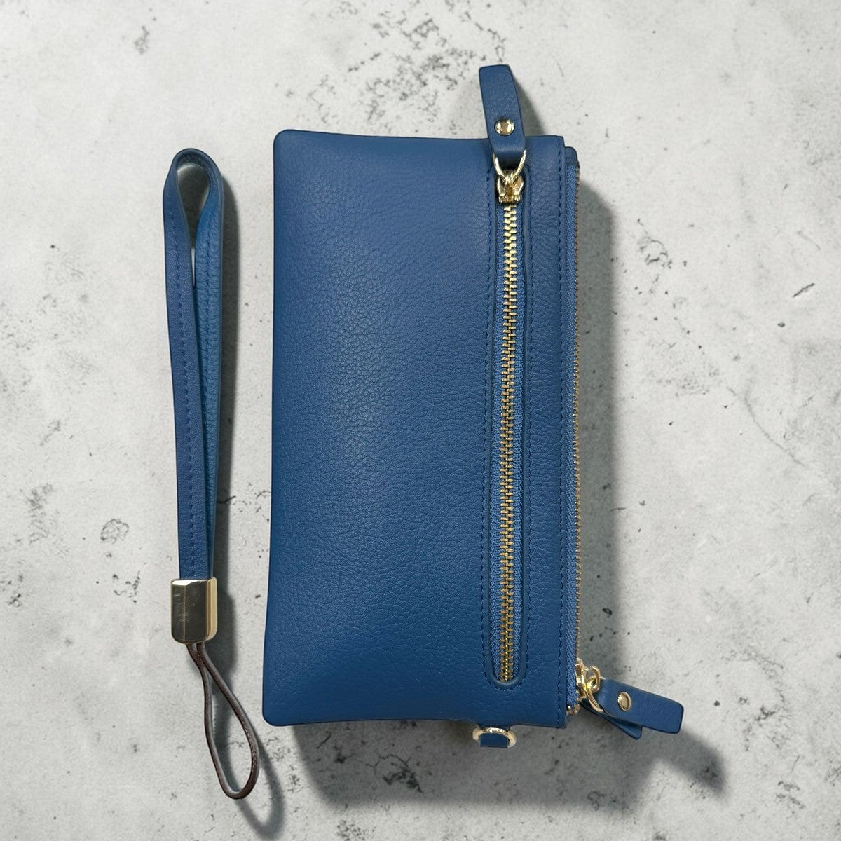 Sina Footwear genuine blue leather wallet with gold zipper and wrist strap. Bi-fold design with multiple card slots.
