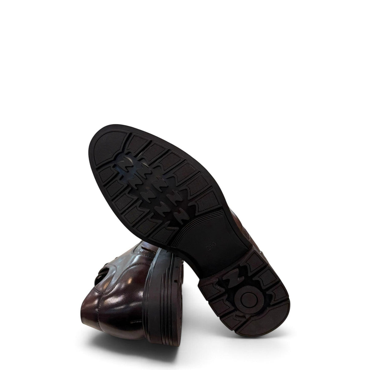 Sina Footwear dark brown leather derby shoe with brogue-inspired perforated details and a lightweight chunky sole.
 photo of the bottom side