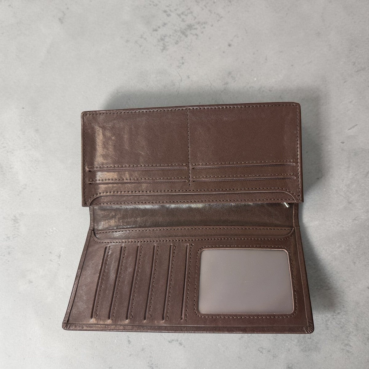 Sina Footwear brown genuine leather bi-fold wallet with multiple card slots and ID window.