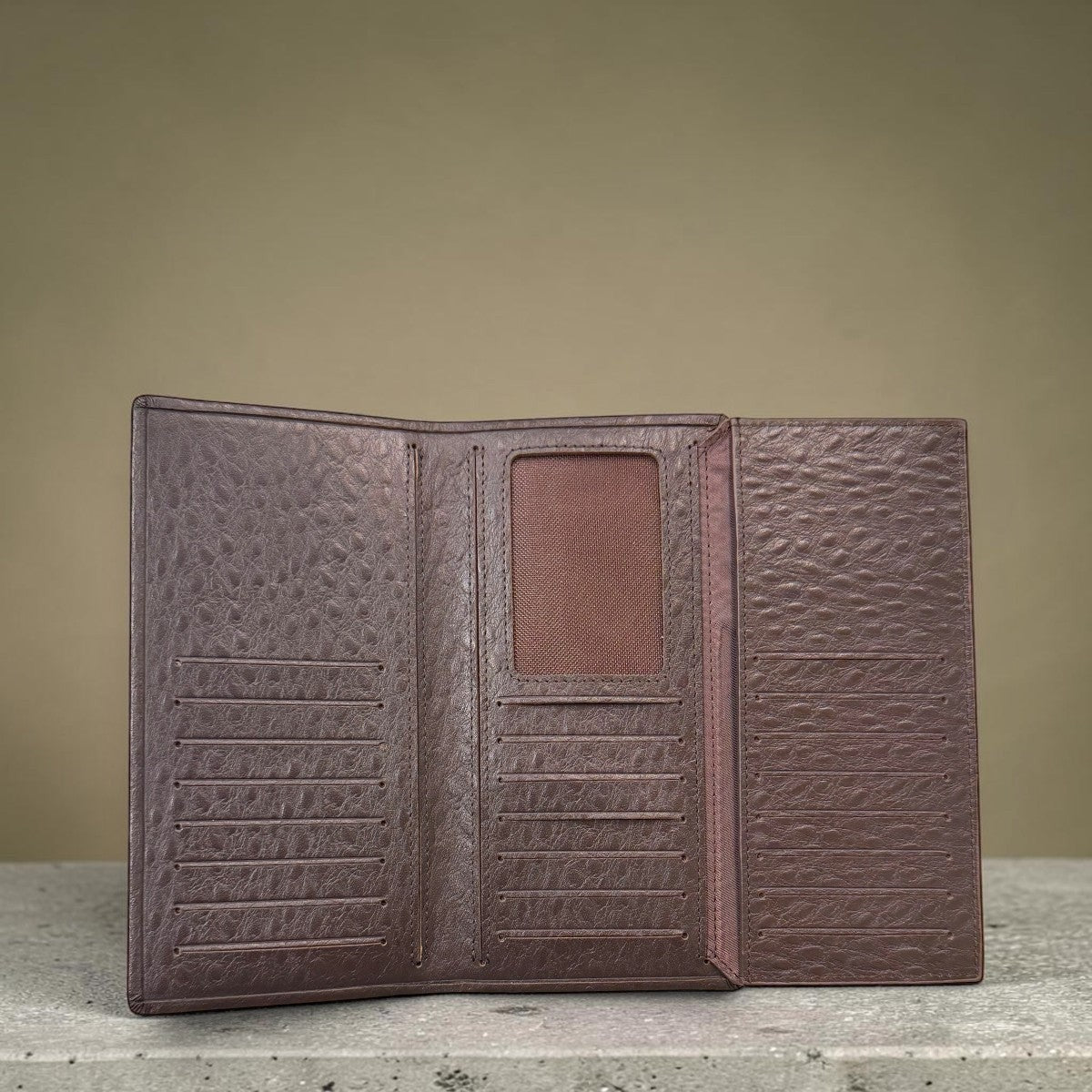 Sina Footwear brown genuine leather tri-fold wallet with multiple card slots and ID window.